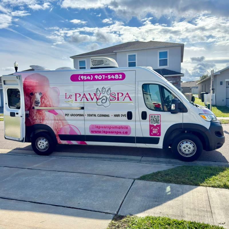 The Le Paw Spa mobile grooming van parked on a driveway